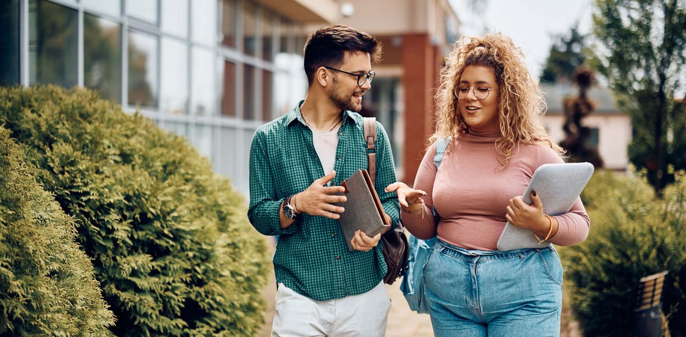 Two college students walking and talking