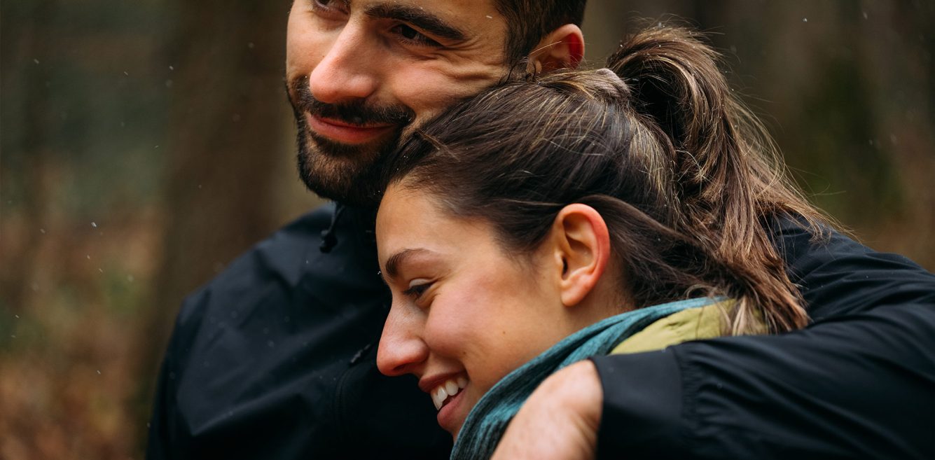 Woman and man hugging