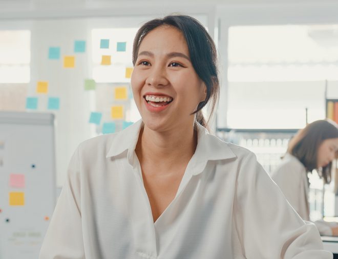 A woman in an office smiling