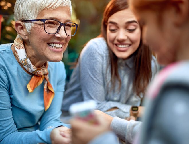 An older woman smiling at someone